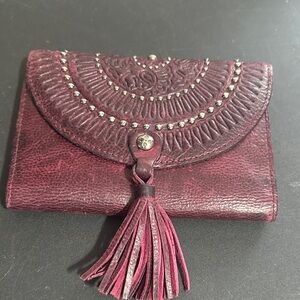 Patricia Nash Colli burgundy distressed studded leather trifold wallet.
